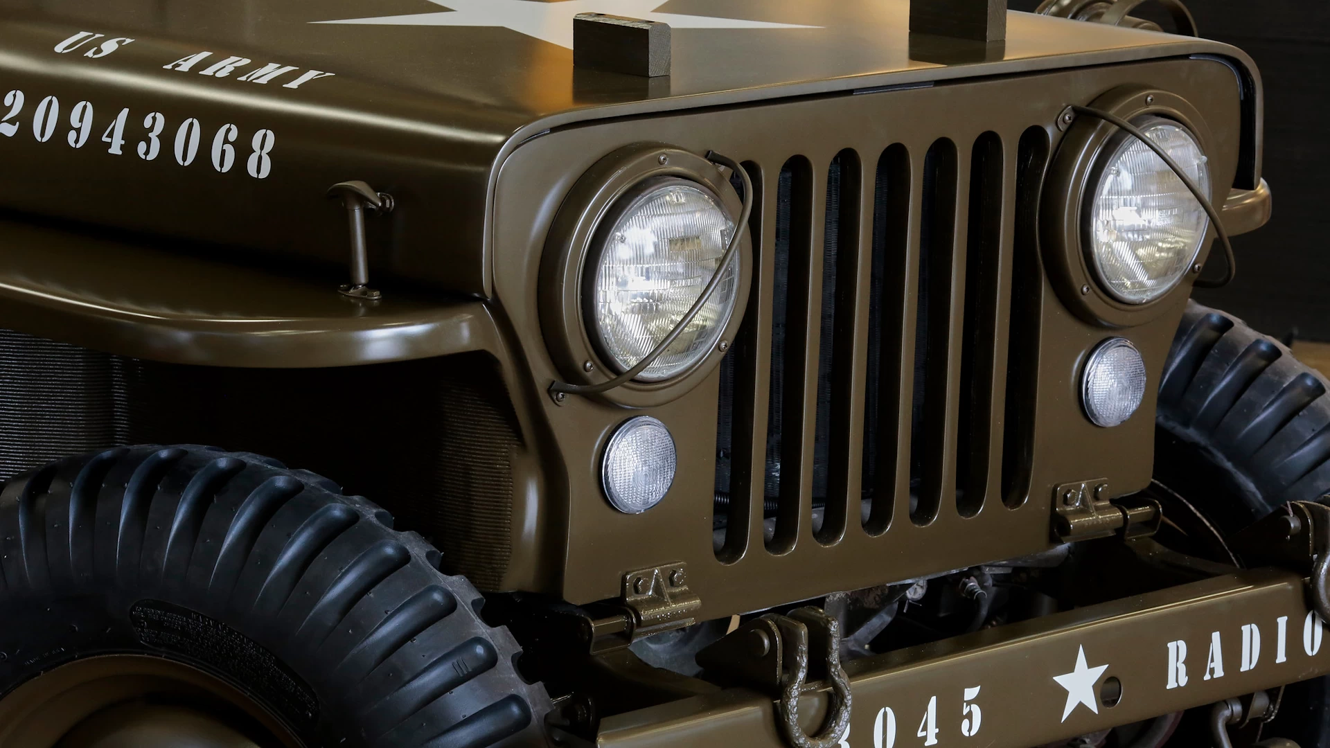 Close up front right view of a brown 3d printed plastic 1952 willys army jeep