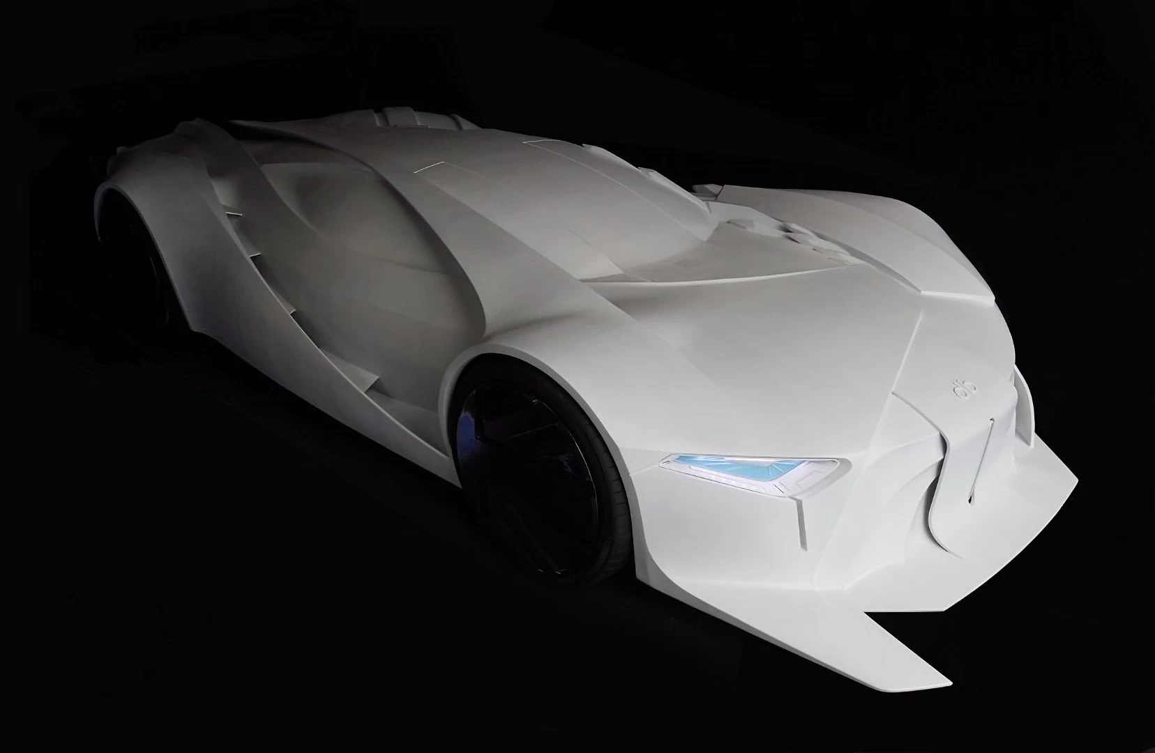 Front right view of a white futuristic super car 3d printed in resin