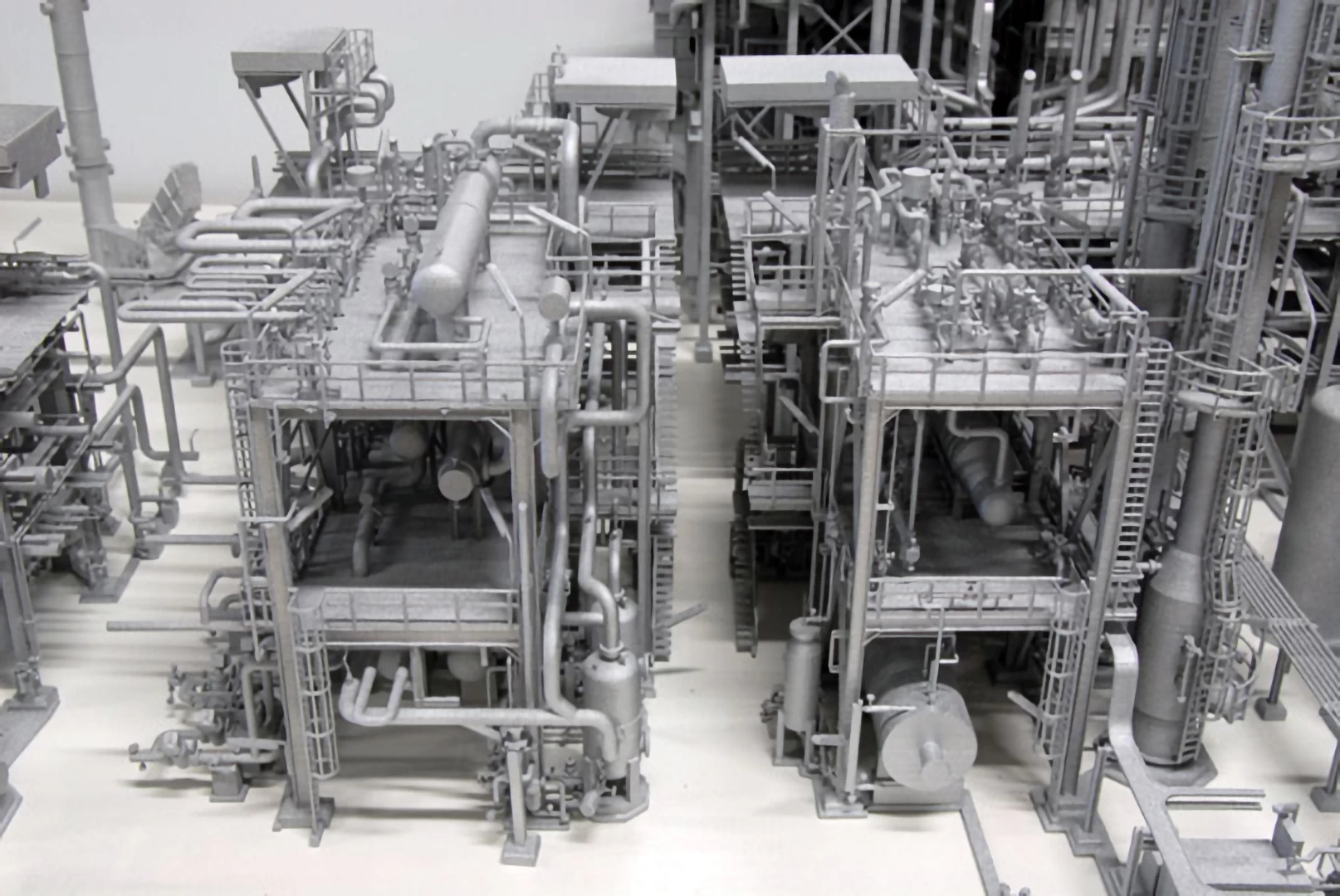 Rear view of silver model of a natural gas plant 3d printed in sintered nylon