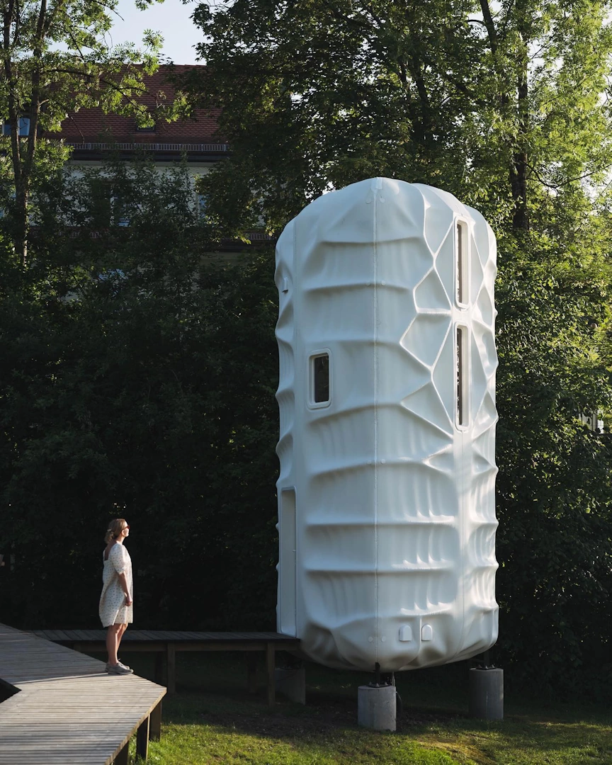 Corner view of white 3d printed plastic habitat with wooden walkway