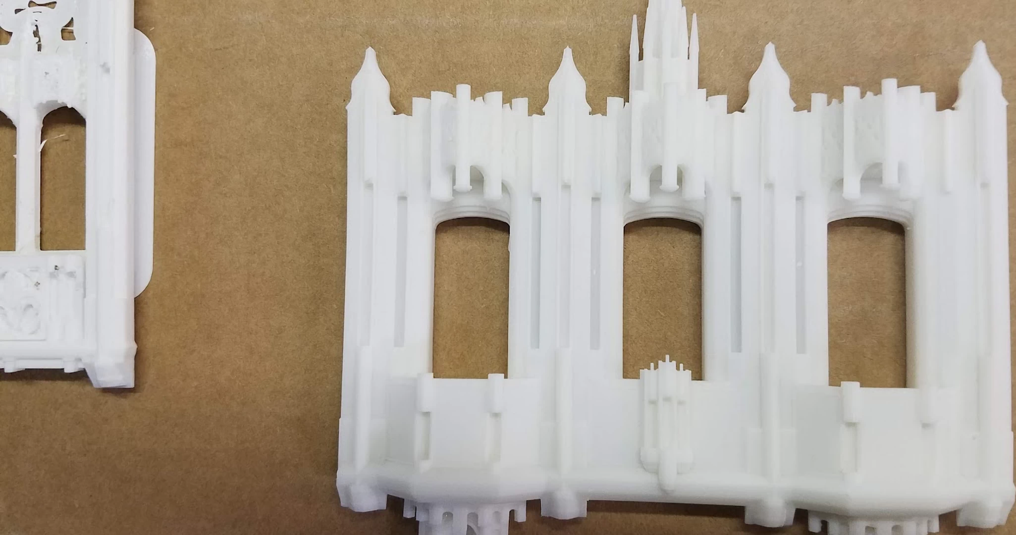 View of a white 3d printed parts of gothic shaped building model during assembly